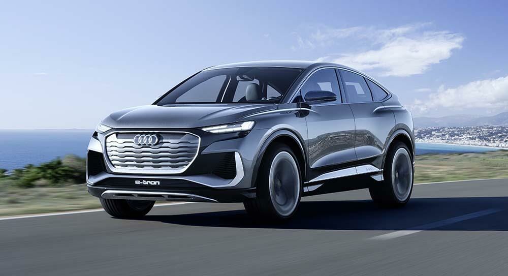 Q4 Sportback e-tron concept on the road front drive, driving shot_805f6570-233e-46a7-bdd5-1a3c2dd7bf25